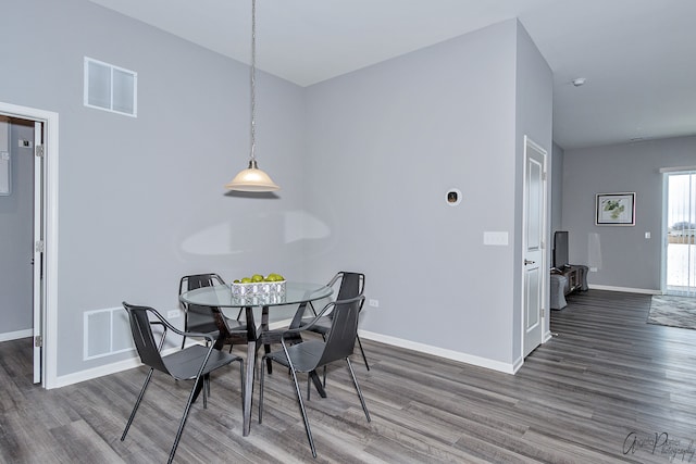 dining space featuring dark hardwood / wood-style flooring