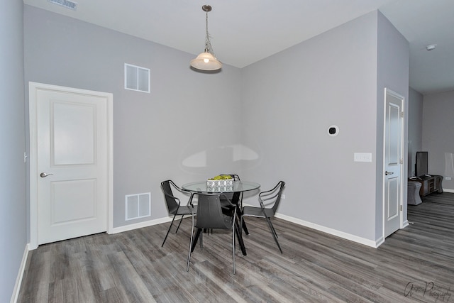 dining room featuring dark hardwood / wood-style flooring