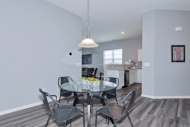 dining area featuring dark hardwood / wood-style floors