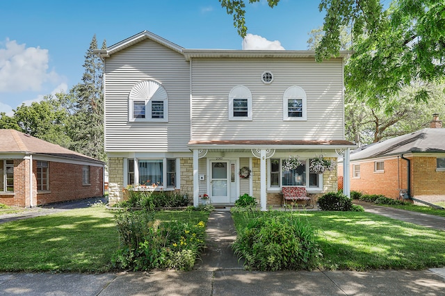 view of front of house featuring a porch and a front yard