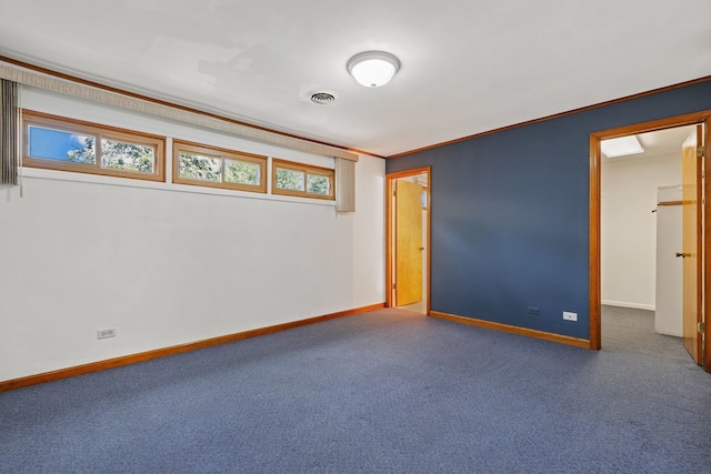 unfurnished bedroom featuring carpet and crown molding