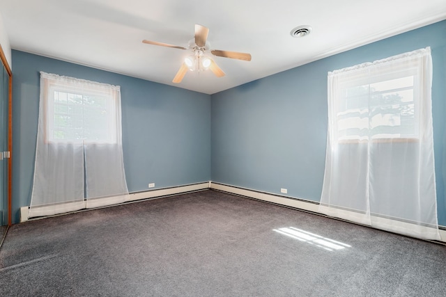 carpeted spare room featuring ceiling fan