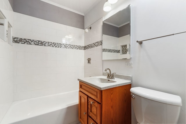 full bathroom featuring tiled shower / bath, toilet, crown molding, and vanity