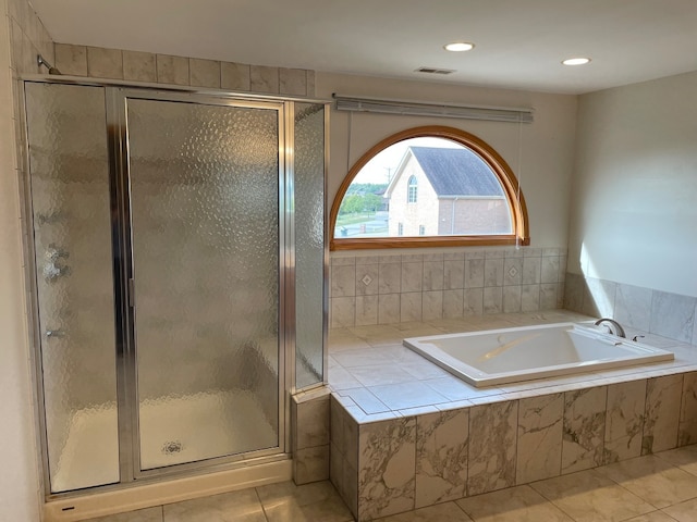 bathroom featuring separate shower and tub and tile patterned floors