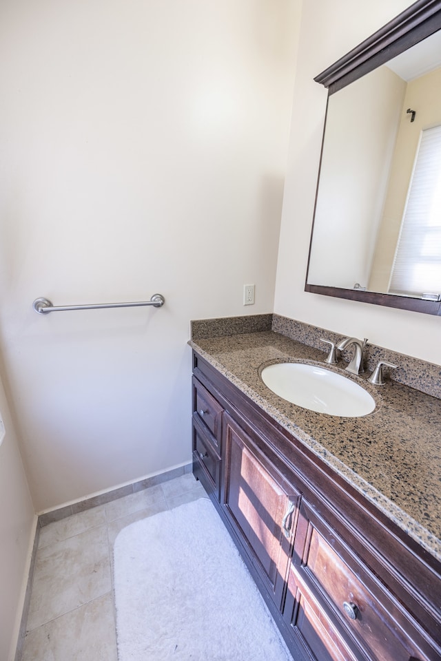 bathroom with tile patterned flooring and vanity