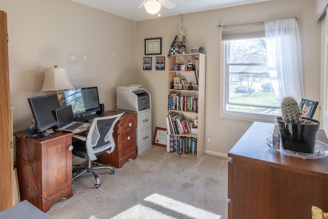 office space featuring light colored carpet and ceiling fan