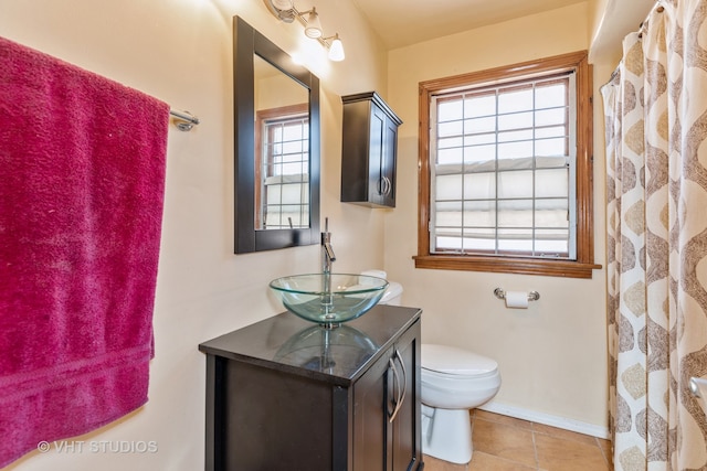 bathroom with tile patterned flooring, vanity, toilet, and a shower with shower curtain