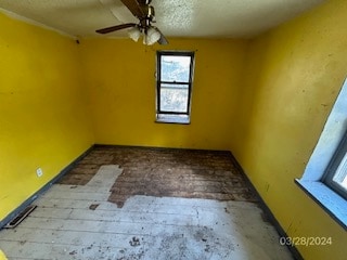 unfurnished room featuring ceiling fan