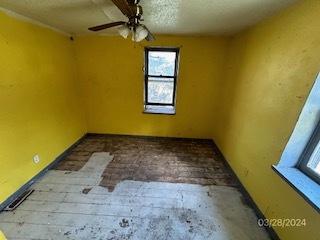 472 Hillcrest Dr, Creve Coeur, IL 61610 - unfurnished room with a textured ceiling and a ceiling fan