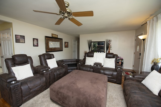 living room with ceiling fan and light carpet