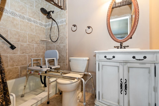 full bathroom featuring tiled shower / bath combo, vanity, and toilet