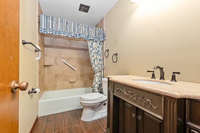 full bathroom featuring vanity, shower / bathtub combination with curtain, and toilet