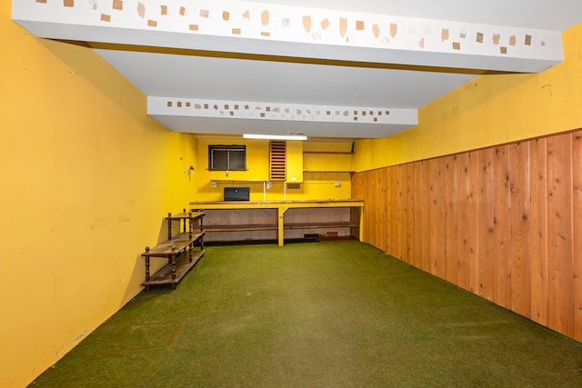 bar featuring carpet and wood walls