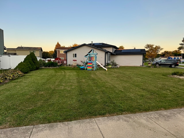 view of yard at dusk