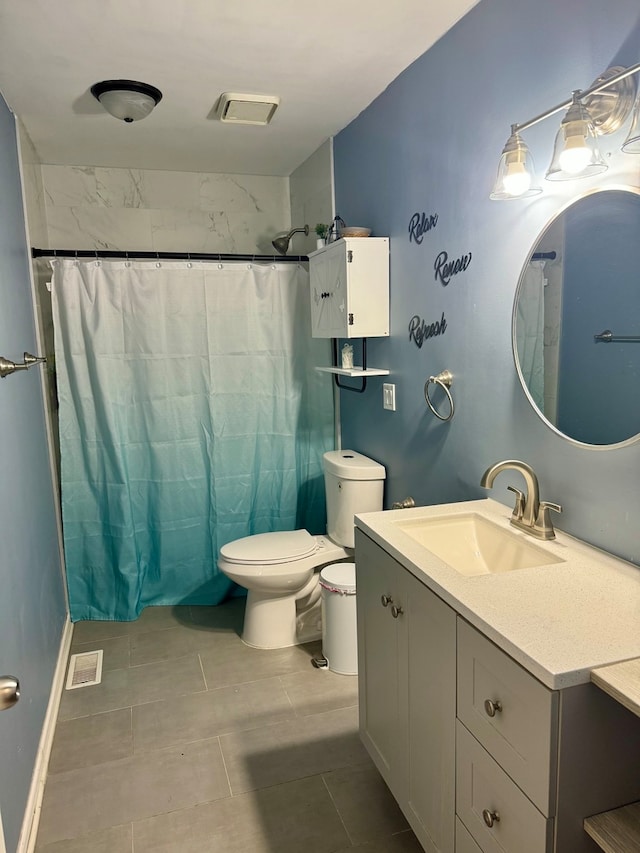 bathroom with vanity, toilet, a shower with shower curtain, and tile patterned floors