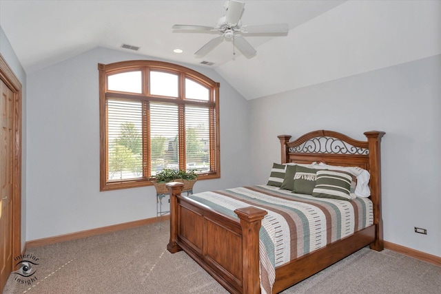 bedroom featuring light carpet, vaulted ceiling, and ceiling fan