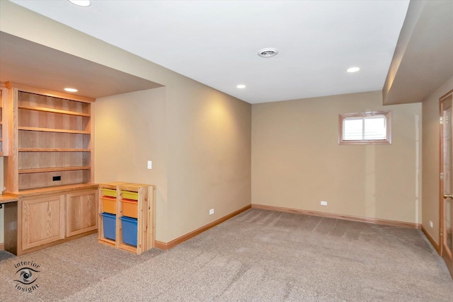 basement with light colored carpet