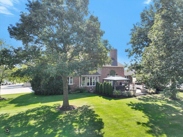 view of front of house with a front lawn