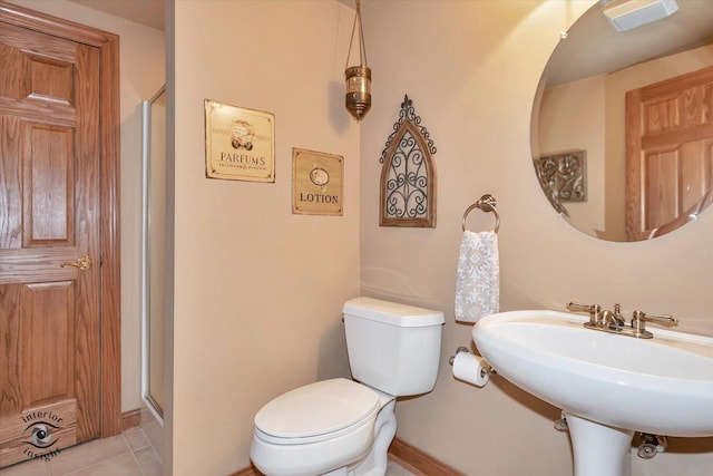 bathroom with sink, tile patterned floors, and toilet