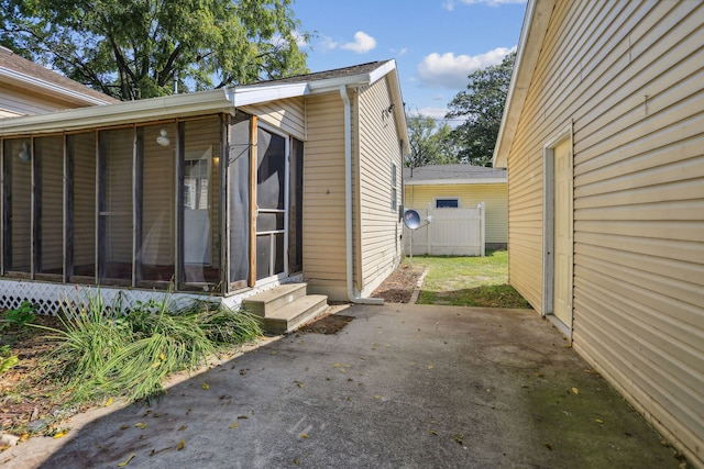 exterior space featuring a sunroom and a patio area