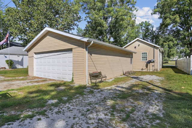 garage featuring a yard