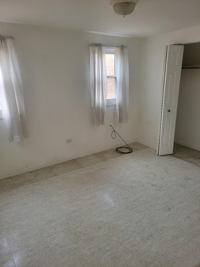 unfurnished bedroom featuring baseboards