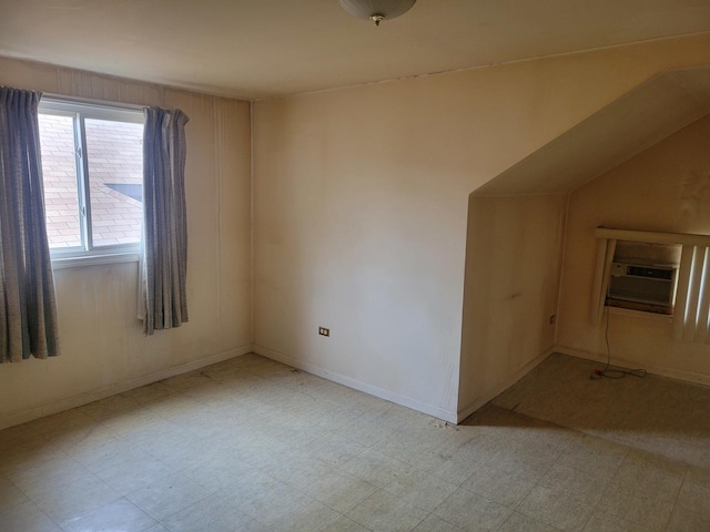 unfurnished room with baseboards and tile patterned floors