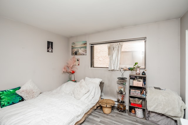 bedroom with light wood-type flooring