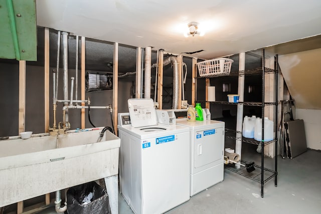 washroom featuring sink and separate washer and dryer