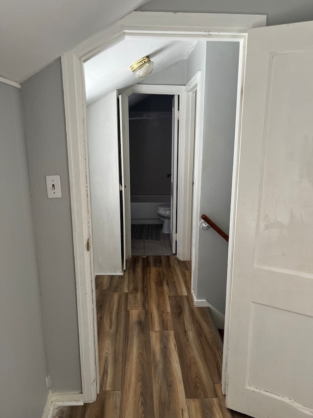 corridor with dark hardwood / wood-style floors