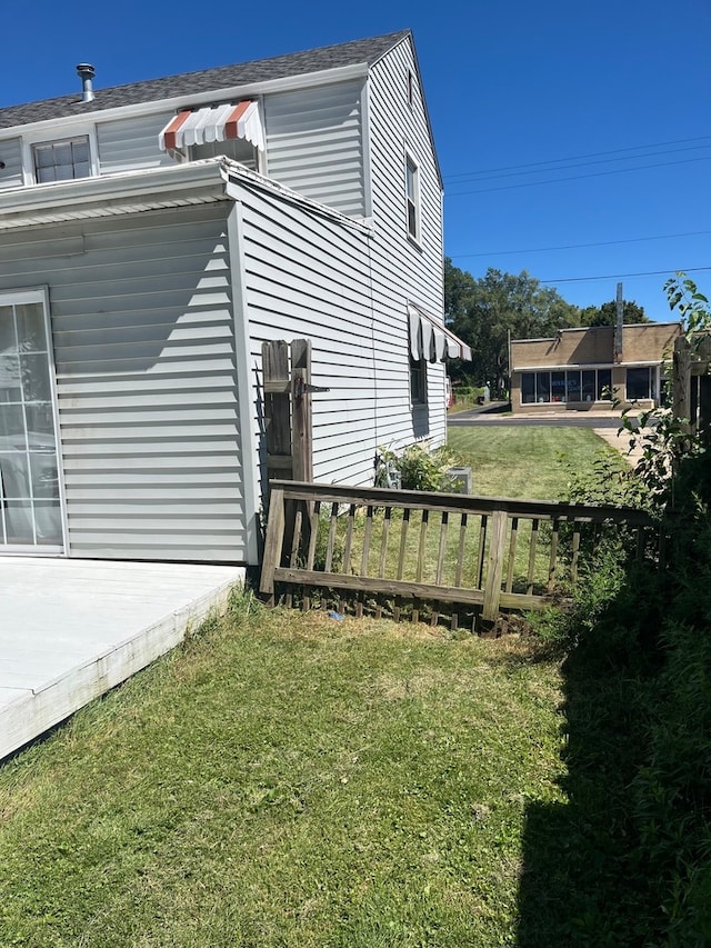 view of home's exterior with a lawn