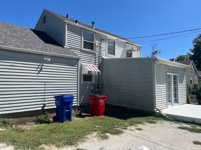 back of house with a wooden deck