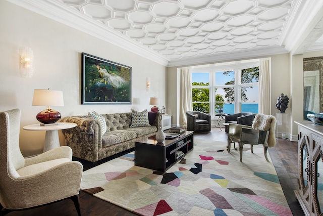 living room featuring crown molding, a water view, and light wood-type flooring