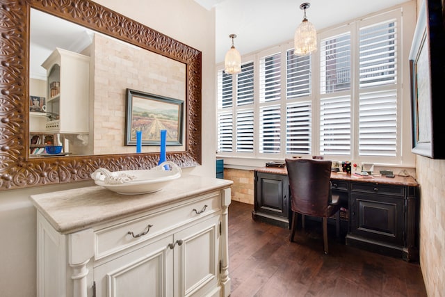 office area featuring a wealth of natural light and dark hardwood / wood-style floors