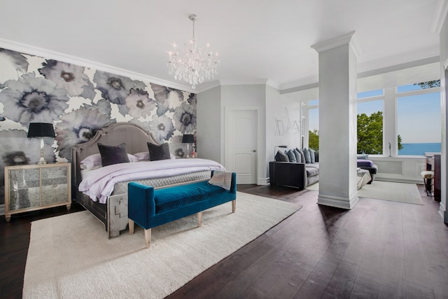 bedroom with ornamental molding, a chandelier, a water view, and dark hardwood / wood-style floors