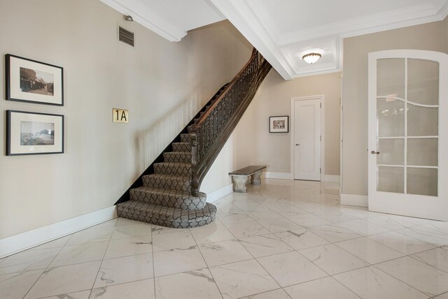 staircase featuring ornamental molding and beamed ceiling