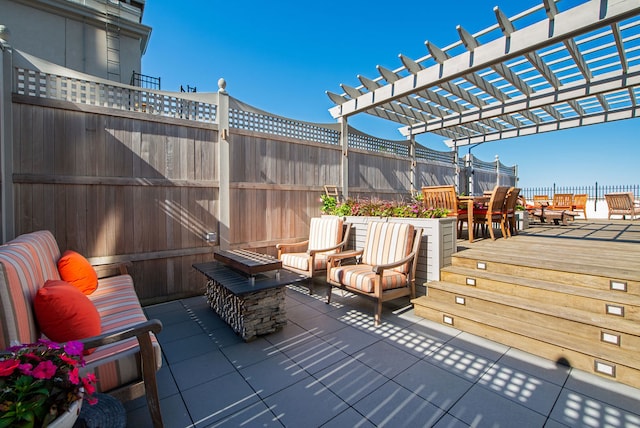 deck with a patio area and a pergola