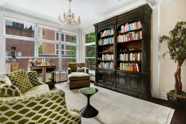 living area with ornamental molding, a chandelier, dark wood-type flooring, and a wealth of natural light