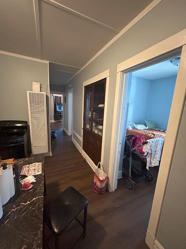 hall featuring crown molding and dark hardwood / wood-style flooring