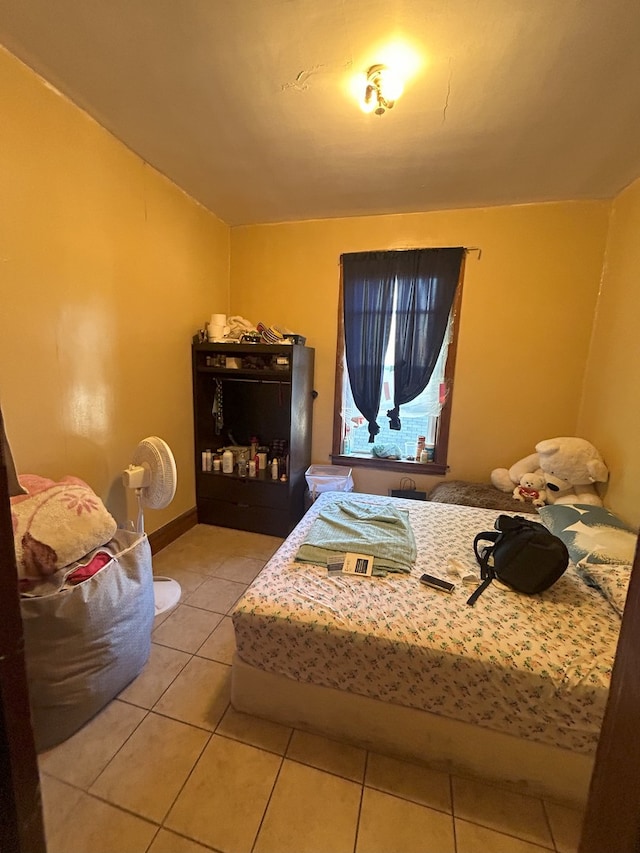 bedroom featuring light tile patterned floors