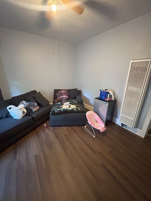 miscellaneous room with ceiling fan and dark hardwood / wood-style floors