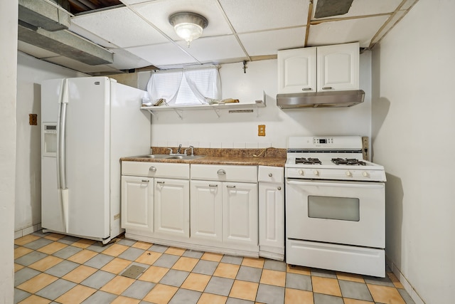 kitchen featuring white appliances, a drop ceiling, white cabinetry, and sink