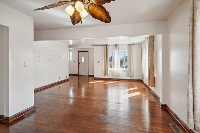 spare room featuring wood-type flooring and ceiling fan