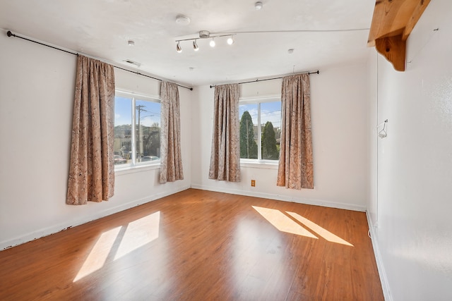 unfurnished room featuring light wood-type flooring