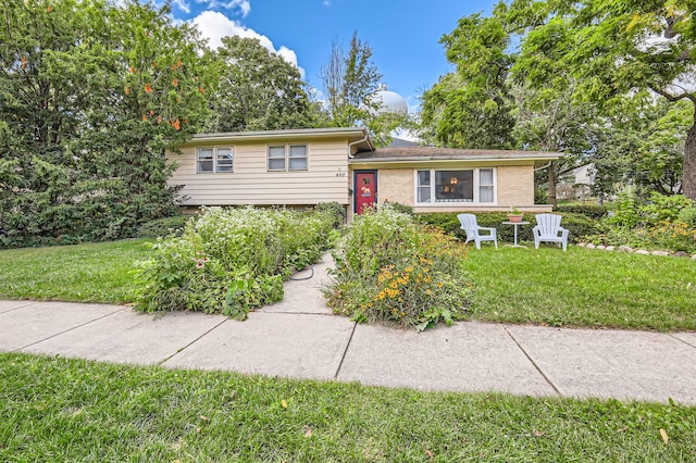 tri-level home featuring a front yard