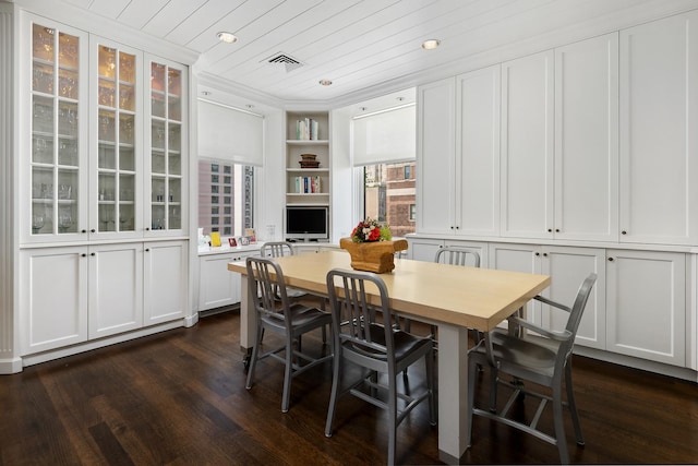 dining area featuring dark wood finished floors, wooden ceiling, recessed lighting, and visible vents