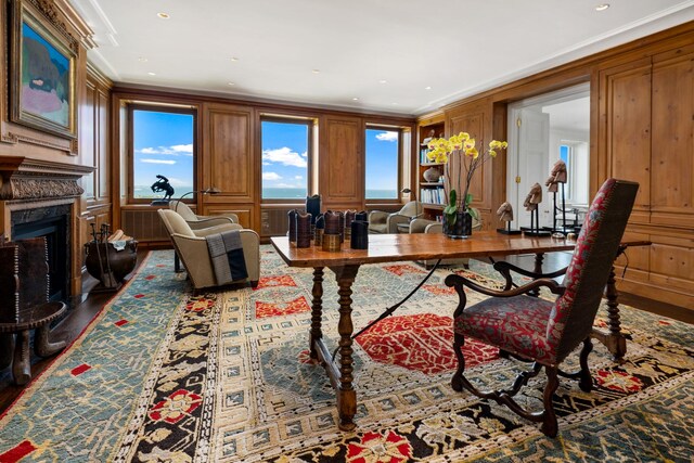 office area with recessed lighting, wood finished floors, ornamental molding, and a high end fireplace