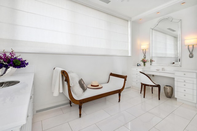 living area featuring light tile patterned floors, visible vents, and crown molding