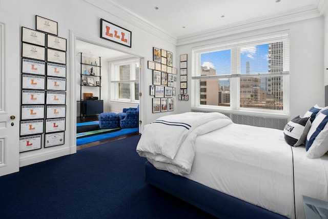 bedroom featuring crown molding and carpet floors