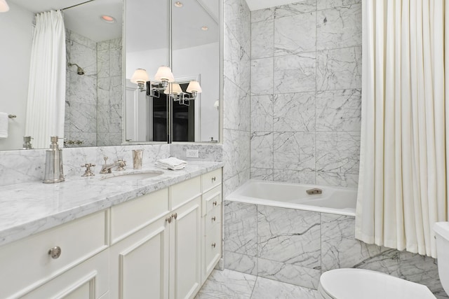 bathroom with toilet, vanity, marble finish floor, tile walls, and tiled shower / bath